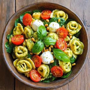 - 12 oz cheese tortellini - 1 cup cherry tomatoes, halved - 1 cup fresh baby spinach - 1/2 cup basil pesto - 1/4 cup sour cream - 2 tablespoons olive oil - 1/4 cup pine nuts, toasted - Fresh basil leaves - 1/2 cup mozzarella balls, halved To make a creamy pesto tortellini salad, you need fresh ingredients. Cheese tortellini forms the base. Choose a good brand for the best flavor. Cherry tomatoes add a burst of sweetness. Halve them for easy mixing. Baby spinach brings color and crunch. For the dressing, mix basil pesto, sour cream, and olive oil. This creamy blend holds the salad together. It adds richness and flavor. Adjust the amount of olive oil for a lighter touch, if desired. Optional garnishes elevate the dish. Toasted pine nuts add a nice crunch. Fresh basil leaves give a bright taste. Halved mozzarella balls melt in your mouth. These additions make the salad even more delightful. This salad is perfect for picnics or gatherings. It’s easy to make and full of flavor. Enjoy the fresh and creamy taste! To start, you need to cook the tortellini. Boil water in a pot and add a pinch of salt. Once it boils, add 12 ounces of cheese tortellini. Cook until al dente, about 3-5 minutes. Drain the tortellini in a colander. Let it cool for a few minutes. Now it's time to make the dressing. In a big bowl, mix 1/2 cup of basil pesto, 1/4 cup of sour cream, and 2 tablespoons of olive oil. Whisk this mixture until it becomes smooth and creamy. Add the cooled tortellini to the bowl with the dressing. Gently toss to coat the pasta well. Next, fold in 1 cup of halved cherry tomatoes, 1 cup of fresh baby spinach, and 1/2 cup of halved mozzarella balls. Add 1/4 cup of toasted pine nuts for a nice crunch. Season with salt and pepper to taste. Cover the bowl with plastic wrap and refrigerate the salad for at least 30 minutes. This allows all the flavors to blend well. When ready to serve, give the salad a gentle stir and adjust the seasoning if needed. Enjoy this fresh and tasty dish! When picking tortellini, focus on fresh or frozen options. Fresh tortellini cooks quickly. It gives a nice texture. Frozen tortellini is handy and lasts longer. Look for cheese-filled types for a creamy taste. You can also try spinach or mushroom tortellini for added flavor. If sour cream isn't your thing, try Greek yogurt. It adds a nice tang. Cream cheese works well too, but it will make the salad thicker. You can also use cashew cream for a dairy-free option. Just blend soaked cashews with a little water until smooth. Pair this salad with grilled chicken for a heartier meal. Garlic bread is a great side, too. For a lighter option, serve it with a crisp green salad. A chilled white wine complements the flavors well. You can even enjoy it as a cold pasta dish on a picnic. {{image_2}} You can make this salad heartier by adding protein. Grilled chicken is a great choice. It adds a nice flavor and extra filling. Cook the chicken with simple spices, then slice it. Shrimp is another option. Just sauté them quickly in olive oil. Both options boost the protein and make it a full meal. If you want to switch up the veggies, cherry tomatoes and spinach work well. You can use bell peppers for a sweet crunch. They add color and flavor. Another option is to use arugula instead of spinach. It brings a peppery taste that pairs well with the creamy pesto. For a gluten-free version, choose gluten-free tortellini. Many stores sell great options that taste good. If you want a vegan salad, use a plant-based pesto and swap the sour cream for cashew cream or a dairy-free yogurt. These changes keep the salad tasty and inclusive for everyone. To store your creamy pesto tortellini salad, place it in an airtight container. This keeps the salad fresh and prevents odors from mixing. Make sure to cool the salad first before sealing it. This step helps keep the texture and taste just right. You can refrigerate it for easy access later. For the best quality, consume the salad within three days. After that, the flavor and texture might change. If you notice any off smells or changes in color, it’s best to discard it. Enjoying the salad while it's fresh ensures you get the full creamy taste. Freezing this salad is possible, but it might change the texture. If you want to freeze it, separate the dressing from the salad. Freeze the tortellini and veggies in a container. When ready to eat, thaw overnight in the fridge. Mix in the dressing just before serving for the best flavor. Yes, you can use store-bought pesto. It saves time and adds great flavor. Fresh pesto has a stronger taste, but store-bought is still good. Look for brands with simple, fresh ingredients. If you choose store-bought, mix it well with sour cream for creaminess. This keeps the salad flavorful and easy to make. You can refrigerate the salad for up to three days. To keep it fresh, store it in an airtight container. Let the salad chill for at least 30 minutes before serving. This helps all the flavors blend nicely. If you see any liquid on top, just give it a light stir. This salad pairs well with many sides. Try serving it with garlic bread or a green salad. For something hearty, grilled chicken or shrimp work great. A simple glass of white wine adds a nice touch too. You can also serve it with a light fruit salad for a refreshing contrast. This salad combines cheese tortellini, fresh veggies, and creamy pesto dressing. You can customize it with proteins or different vegetables. Remember, chilling enhances the flavors. Store any leftovers properly to keep them fresh. Enjoy experimenting with flavors and combinations. This dish shines as a versatile option for any meal. Your culinary creativity makes it a fun way to share delicious food with others.