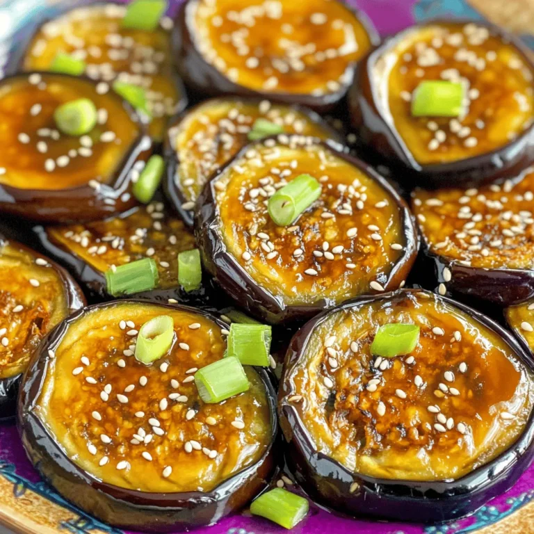 - 2 medium-sized eggplants, sliced into ½ inch rounds - 3 tablespoons white miso paste - 2 tablespoons maple syrup - 1 tablespoon soy sauce - 1 tablespoon sesame oil - 1 teaspoon rice vinegar - 1 teaspoon grated ginger - 1 teaspoon minced garlic - 1 tablespoon sesame seeds (for garnish) - 2 green onions, sliced (for garnish) - Prep time: 10 minutes - Total time: 20 minutes - Servings: 4 The ingredients for Air Fryer Miso Glazed Eggplant are simple yet flavorful. You need two medium-sized eggplants. These should be sliced into rounds about half an inch thick. The miso glaze is key. You mix three tablespoons of white miso paste with two tablespoons of maple syrup. This gives a sweet touch. Then, add one tablespoon of soy sauce and one tablespoon of sesame oil for depth. Rice vinegar adds a tangy kick. Grated ginger and minced garlic bring warmth and zest. Finally, you will garnish the dish with one tablespoon of sesame seeds and two green onions. This recipe is quick. It takes just ten minutes to prep and twenty minutes total. You can serve four people, making it perfect for a small gathering or family meal. To start, you need to make the miso glaze. Grab a small bowl. Add three tablespoons of white miso paste. Next, pour in two tablespoons of maple syrup. Then, add one tablespoon of soy sauce, one tablespoon of sesame oil, one teaspoon of rice vinegar, one teaspoon of grated ginger, and one teaspoon of minced garlic. Whisk these ingredients together until smooth. Make sure there are no lumps. A smooth glaze coats the eggplant well. Now, move on to the eggplant. Take two medium-sized eggplants. Slice them into rounds, about half an inch thick. Make sure the slices are even. This helps them cook at the same rate. Place the sliced eggplant in a large bowl. Pour the miso glaze over the eggplant. Mix gently until each slice is well-coated. You want the glaze to cling to each piece. Next, preheat your air fryer to 375°F (190°C). This step is important for even cooking. Once it’s ready, start placing the glazed eggplant slices in a single layer in the basket. Do not overcrowd the basket. You may need to cook in batches. Air fry the eggplant slices for 10 to 12 minutes. Flip them halfway through. This helps ensure they cook evenly and get nice and caramelized. When they are tender and golden, they are done. After cooking, take them out of the air fryer. Sprinkle with sesame seeds and sliced green onions for garnish. This adds a nice touch and extra flavor. To get that perfect caramelization on your eggplant, cook at 375°F (190°C). This temperature lets the glaze melt and create a nice crust. Cook the eggplant for 10-12 minutes. Flip the slices halfway for even cooking. If your air fryer is small, work in batches. This way, each piece can fry without crowding. You can add more flavor with some extra spices. Try a pinch of chili flakes for heat or a splash of lime juice for tang. If you want a deeper taste, marinate the eggplant slices for 30 minutes before cooking. This lets the flavors soak in, making each bite even better. You can also swap out the maple syrup for honey or agave for a different sweetness. {{image_2}} You can change the flavor of your Air Fryer Miso Glazed Eggplant by using different types of miso. White miso gives a sweet taste. You can try red miso for a bolder flavor. Yellow miso is a great middle ground. Each type adds its own twist to the dish. If you want to swap out maple syrup, you have options. Honey or agave syrup both work well. You can use brown sugar too. Just mix it well with the other glaze ingredients. Each sweetener will change the taste slightly, so feel free to experiment. For those needing gluten-free options, use tamari instead of soy sauce. Tamari has a similar taste and works great in this recipe. Make sure your miso paste is also gluten-free. If you want vegan substitutions, stick with the original recipe. It is already vegan-friendly. Just ensure your miso and maple syrup are pure and without animal products. Enjoy a tasty dish that fits your dietary needs! To keep your Air Fryer Miso Glazed Eggplant fresh, cool it first. Place the eggplant in an airtight container. Store it in the fridge for up to four days. The eggplant may lose some crispness. To help maintain texture, layer parchment paper between slices. This will reduce moisture buildup. When ready to eat, you can reheat the eggplant. The best way is to use your air fryer. Preheat it to 350°F (175°C). Place the eggplant in the basket for about five minutes. This method keeps the eggplant crispy. You can also use a microwave if you’re short on time. Just heat it for 30 seconds. Be careful not to overheat, as this can make the eggplant soggy. Yes, you can use other vegetables! Try zucchini, bell peppers, or mushrooms. Each will bring a unique taste. Just slice them similarly to the eggplant. You may need to adjust cooking times slightly. Check for tenderness and caramelization. You will know the eggplant is cooked when it is soft and golden. The edges should look crispy and caramelized. A fork should easily pierce through the slices. If it’s still firm, just air fry it a bit longer. This dish pairs well with rice or quinoa. You can also serve it with a fresh salad. It makes a great side for grilled meats or tofu. Try adding it to a grain bowl for a tasty meal! This blog post covered a simple and tasty recipe for Air Fryer Miso Glazed Eggplant. You learned the key ingredients, preparation time, and step-by-step instructions. I shared tips to get caramelized eggplant and how to tweak the flavors. We also explored variations and storage info to keep your dish fresh. Enjoy experimenting with this recipe in your kitchen. It’s a quick way to make a delicious dish that will impress everyone at the table. Happy cooking!