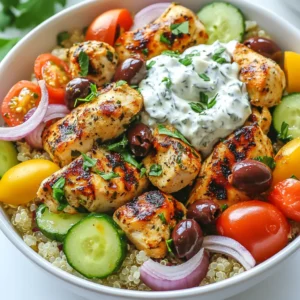 For Greek Chicken Souvlaki Bowls, you need fresh and tasty ingredients. Here’s what you will need: - 1 lb boneless, skinless chicken thighs, cut into 1-inch cubes - 1 cup cooked quinoa or rice - 1 cup cherry tomatoes, halved - 1 cucumber, diced - 1/2 red onion, thinly sliced - 1/2 cup Kalamata olives, pitted and quartered - 1 cup Tzatziki sauce (store-bought or homemade) - Fresh parsley, chopped (for garnish) These items create a colorful and healthy base for your bowl. The marinade is key for flavor. Here’s what goes into it: - 3 tablespoons olive oil - Juice of 1 lemon - 3 cloves garlic, minced - 1 tablespoon dried oregano - Salt and pepper to taste This mix makes the chicken tender and full of flavor. The lemon and garlic add a nice zing that pairs well with the other fresh ingredients. To make your bowls even better, consider these add-ins: - Feta cheese, crumbled - Pita bread on the side - Extra veggies like bell peppers or spinach These options give you more flavor and texture. They also allow you to customize your dish to your liking. Enjoy mixing and matching to find your favorite version! {{ingredient_image_1}} To start, you need to create the marinade. In a large bowl, mix together these ingredients: - 3 tablespoons olive oil - Juice of 1 lemon - 3 cloves garlic, minced - 1 tablespoon dried oregano - Salt and pepper to taste This mixture adds flavor and keeps the chicken tender. Cut 1 pound of boneless, skinless chicken thighs into 1-inch cubes. Add the chicken to the marinade and stir well. Cover the bowl with plastic wrap. Let it sit in the fridge for at least 30 minutes, or up to 2 hours. The longer it marinates, the better the flavor. Next, it’s time to grill the chicken. Preheat your grill or grill pan over medium-high heat. Once hot, place the marinated chicken pieces in a single layer. Grill for about 10 to 15 minutes. Turn them occasionally. You want nice grill marks and the chicken should be cooked through. Check that the internal temperature reaches 165°F (75°C). Once done, remove the chicken and let it rest for a few minutes. Now, it’s time to build your bowls. Start with 1 cup of cooked quinoa or rice at the bottom of each bowl. Top it with the grilled chicken. Then, add: - 1 cup cherry tomatoes, halved - 1 cucumber, diced - 1/2 red onion, thinly sliced - 1/2 cup Kalamata olives, pitted and quartered Finally, drizzle 1 cup of Tzatziki sauce over everything. For a finishing touch, garnish with chopped fresh parsley. This adds color and a burst of flavor. Enjoy your Greek Chicken Souvlaki Bowls! To make a great marinade, start with good ingredients. Use fresh lemon juice, olive oil, and minced garlic. These flavors will soak into the chicken well. Mix them in a bowl with dried oregano, salt, and pepper. This mix is key to tasty chicken. Let it sit for at least 30 minutes. For even better taste, marinate it for up to 2 hours. Grilling chicken can be tricky. To keep it moist, do not overcook it. Grill the chicken for about 10-15 minutes. Turn the pieces often to get nice grill marks. The chicken is done when it reaches 165°F (75°C). Let the chicken rest for a few minutes after grilling. This helps the juices stay inside, making it tender and juicy. A beautiful bowl makes the meal more inviting. Start by placing cooked quinoa or rice at the bottom. Then, layer the grilled chicken on top. Add cherry tomatoes, diced cucumber, and sliced red onion. Don’t forget the Kalamata olives! Drizzle the Tzatziki sauce on top. For an extra touch, sprinkle some chopped parsley. You can also serve warm pita bread on the side. A little crumbled feta cheese can make it even better! Pro Tips Marinate Longer for Flavor: For the best flavor, marinate the chicken for at least 2 hours. This allows the spices and lemon to penetrate the meat effectively. Use a Meat Thermometer: Ensure your chicken is perfectly cooked by using a meat thermometer. The internal temperature should reach 165°F (75°C) for safe consumption. Customize Your Toppings: Feel free to mix and match toppings according to your preference. Adding ingredients like roasted red peppers or feta cheese can enhance the flavor profile. Presentation Matters: Serve the bowls in colorful dishes and arrange the ingredients in sections. This not only looks appealing but also allows guests to choose their favorite components. {{image_2}} You can easily make these bowls vegetarian or vegan. Instead of chicken, use cubed tofu or tempeh. Marinate them just like the chicken for great flavor. Grilling or pan-frying gives them a nice texture. You can also add hearty vegetables like bell peppers or zucchini. These add color and crunch to your meal. If you prefer other proteins, try shrimp or lamb. Marinate shrimp the same way as chicken. Grill them quickly for about 3-5 minutes. Lamb has rich flavors that pair well with the marinade. You can also use beef for a heartier option. Just adjust the cooking time based on the meat you choose. Experiment with different marinades for unique tastes. A yogurt-based marinade gives a creamy texture. You can mix yogurt, garlic, and spices like cumin or paprika. For a spicy twist, add chili flakes or harissa. Each marinade will change the flavor and make your bowl fun and fresh! After enjoying your Greek Chicken Souvlaki Bowls, you may have some leftovers. Store them in an airtight container. Keep the chicken, veggies, and sauce separate if possible. This keeps everything fresh and tasty. Leftovers will last in the fridge for about three days. To reheat your chicken, warm it in a pan over medium heat. This keeps it juicy and flavorful. You can also use the microwave. If using a microwave, cover the bowl with a lid or paper towel. Heat for 1-2 minutes or until hot. For the veggies, a quick sauté will do the trick. If you want to freeze your Greek Chicken Souvlaki Bowls, it’s best to freeze the chicken and quinoa or rice separately. Place them in freezer bags, removing as much air as possible. They can last up to three months in the freezer. When ready to eat, thaw in the fridge overnight. Reheat as mentioned before for a quick meal. To make Tzatziki sauce, you need a few simple ingredients. Start with 1 cup of plain yogurt. Add 1 cup of grated cucumber, which you should squeeze to remove excess water. Mix in 2 cloves of minced garlic, 1 tablespoon of olive oil, and 1 tablespoon of lemon juice. Season with salt and pepper to taste. Stir well and chill for about 30 minutes. This sauce is cool and refreshing, perfect for your Greek Chicken Souvlaki Bowls. Yes, you can use chicken breast instead of thighs. Chicken breast is leaner but can dry out faster. If you choose this option, cook the chicken carefully. Cut the breast into 1-inch cubes and marinate as directed. Grill until the internal temperature reaches 165°F (75°C). Keep an eye on the cooking time. Chicken breast often cooks quicker, so adjust as needed. Greek Chicken Souvlaki Bowls pair well with several sides. Consider serving warm pita bread or a Greek salad with feta cheese. You can also add roasted vegetables for extra flavor. If you want more protein, serve with hummus or a side of lentils. These additions will make your meal more filling and delicious. Greek chicken souvlaki bowls are tasty and easy to make. We covered the key ingredients, like chicken and marinade. You learned the steps to marinate and grill the chicken and assemble the bowls. I shared tips to keep the chicken moist and make your dish look great. You can even try vegetarian options or different proteins to mix it up. Remember to store and reheat leftovers wisely. Now, enjoy creating your tasty bowls and impress your friends!