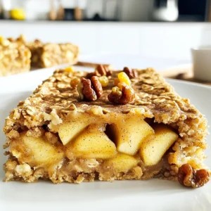 To make these tasty Apple Cinnamon Oatmeal Bars, gather these simple ingredients: - 2 cups rolled oats - 1 cup almond flour - 1 teaspoon baking powder - 1 teaspoon cinnamon - 1/2 teaspoon nutmeg - 1/4 teaspoon salt - 1/2 cup honey or maple syrup - 1/2 cup unsweetened applesauce - 1/4 cup coconut oil, melted - 2 medium apples, peeled and diced - 1/2 cup walnuts, chopped (optional) - 1/4 cup raisins or dried cranberries (optional) These ingredients work together to create a sweet and hearty bar. The oats and almond flour give a great texture, while the apples add natural sweetness. You can swap some ingredients for what you have on hand. Here are a few ideas: - Instead of almond flour, use all-purpose flour or oat flour. - Maple syrup can replace honey for a vegan option. - Any type of apple works. Try Granny Smith for a tart taste. - If you don't have coconut oil, use vegetable oil or butter. These swaps make the recipe flexible and easy to adapt. Want to add more flavor? Here are some tasty options: - Mix in chocolate chips for a sweet twist. - Add pumpkin seeds for a crunch. - Toss in some chia seeds for extra fiber. Feel free to get creative with your add-ins. They can make your bars unique and fun! Start by preheating your oven to 350°F (175°C). This will ensure even baking. Next, take a 9x9-inch baking pan. Grease it lightly or use parchment paper. Parchment paper helps with easy removal later. In a large bowl, combine the rolled oats, almond flour, baking powder, cinnamon, nutmeg, and salt. Stir these dry ingredients well. This ensures that all the flavors mix evenly throughout the bars. In a separate bowl, whisk together the honey or maple syrup, unsweetened applesauce, and melted coconut oil. Mix until the mixture is smooth. The wet ingredients will add moisture and sweetness to the bars. Now, pour the wet mix into the dry ingredients. Stir until they are fully combined. Gently fold in the diced apples and chopped walnuts or raisins if you choose to add them. This step adds great texture and taste to your bars. Spread the batter evenly in the prepared pan. Use a spatula to smooth the top. Bake for 25 to 30 minutes. Look for golden edges and a toothpick should come out clean from the center. Let the bars cool in the pan for about 10 minutes. Then, transfer them to a wire rack to cool completely. Once cooled, cut them into bars for easy serving. To get the best texture in your Apple Cinnamon Oatmeal Bars, use rolled oats. They give a chewy bite, while almond flour makes them tender. If you want softer bars, add a bit more applesauce. For crunch, consider adding chopped walnuts. Bake until golden brown, but don’t overdo it. A toothpick should come out clean for perfect bars. To boost the flavor, use fresh, crisp apples. I like to mix sweet and tart varieties. Adding a pinch of salt will enhance sweetness. If you love spice, try adding a little more cinnamon or nutmeg. You can also mix in vanilla extract for warmth. For a twist, try adding dried cranberries or chocolate chips. These bars are great warm or cold. You can cut them into squares for snacks or breakfast. Serve them with a drizzle of honey or a dollop of yogurt. They also pair well with a hot cup of tea or coffee. Store them in an airtight container for easy snacking all week long. {{image_2}} You can easily make these apple cinnamon oatmeal bars gluten-free. Just swap the rolled oats for certified gluten-free oats. Ensure any other ingredients, like baking powder, are also gluten-free. Almond flour is already gluten-free, making it a great choice. This way, everyone can enjoy these tasty bars without worry. To make these bars vegan, replace honey with maple syrup or agave nectar. Both sweeteners work well and keep the bars moist. You can also use a plant-based oil instead of coconut oil. This keeps the recipe tasty and friendly for those who prefer plant-based foods. Get creative with flavors in your oatmeal bars. You can add spices like ginger or cardamom for extra warmth. Try adding different fruits, like pears or blueberries, for a twist. You can also mix in nuts or seeds, such as pecans or sunflower seeds. This makes the bars unique and fun to eat! To keep your Apple Cinnamon Oatmeal Bars fresh, use an airtight container. This will prevent moisture from getting in and making the bars soggy. Store them at room temperature if you plan to eat them within a week. For longer-lasting freshness, the fridge is a good choice. It helps the bars stay tasty and safe to eat. If you want to save some bars for later, freezing is simple. Cut the bars into squares before freezing. Wrap each piece in plastic wrap, then place them in a freezer bag. This helps keep them fresh. When you want to enjoy a bar, take it out and let it thaw in the fridge overnight. You can also heat it in the microwave for a quick treat. When stored properly, these bars last about one week at room temperature. In the fridge, they can stay good for up to two weeks. Frozen bars can last for up to three months. Just make sure to check for any signs of spoilage before eating. Enjoy your delicious bars anytime! To make these bars gluten-free, swap rolled oats for certified gluten-free oats. Use almond flour, which is gluten-free. Check all labels for hidden gluten. This simple change keeps your bars tasty and safe. Yes, you can replace honey with maple syrup. Both sweeteners work well. You could also try agave syrup for a different taste. Use the same amount to keep the sweetness balanced. Wait until the bars cool before cutting. Use a sharp knife for clean edges. For even pieces, cut them into squares or rectangles. This way, each piece looks great and is easy to grab. Absolutely! These bars are perfect for meal prep. Make a batch and store them in an airtight container. They stay fresh for a week. Grab one for a quick snack or breakfast on busy days. You can find pre-made bars at health food stores or online. Look for brands that focus on natural ingredients. Read the labels to find options that match your taste and dietary needs. This blog post covered everything you need for apple cinnamon oatmeal bars. We detailed the ingredient list and offered smart substitutions and add-ins. The step-by-step instructions guide you through mixing and baking perfectly. I shared tips for the best texture and flavor. You learned about variations like gluten-free and vegan options. Storage info ensures your bars stay fresh and tasty. Now, you can confidently make these bars at home. Enjoy your baking!