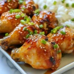 - 10 chicken drumsticks - 1/2 cup honey - 1/4 cup soy sauce (low sodium) - 4 cloves garlic, minced - 1 tablespoon fresh ginger, grated - 1 tablespoon rice vinegar - 1 teaspoon sesame oil - 1/2 teaspoon black pepper - 2 tablespoons chopped green onions - Sesame seeds (for garnish, optional) The main ingredients make this dish sweet and savory. First, the chicken drumsticks are the star. They soak up all the flavors of the marinade. Honey gives a nice sweetness. Soy sauce adds saltiness and depth. Minced garlic and fresh ginger bring warmth. Rice vinegar offers a hint of tang. Sesame oil rounds it all out with a nutty note. Black pepper adds just a bit of spice. For garnishes, I like to use chopped green onions. They add color and a fresh taste. Sesame seeds can also add a nice crunch if you choose to use them. This simple mix of ingredients makes for a tasty meal. When combined, they create a sauce that coats the chicken perfectly. You will love how these flavors blend together, making every bite delicious. {{ingredient_image_1}} - Preheating the oven: Start by preheating your oven to 400°F (200°C). This step warms the oven for even cooking. - Making the marinade: In a bowl, mix together 1/2 cup honey, 1/4 cup low-sodium soy sauce, 4 minced garlic cloves, 1 tablespoon grated ginger, 1 tablespoon rice vinegar, 1 teaspoon sesame oil, and 1/2 teaspoon black pepper. Whisk until blended well. - Coating chicken drumsticks: Place the 10 chicken drumsticks in a large resealable bag or bowl. Pour the marinade over the drumsticks. Make sure they are coated fully. - Refrigeration timing: Seal the bag or cover the bowl. Let the chicken marinate in the fridge for at least 30 minutes. For deeper flavor, marinate up to 4 hours. - Arranging on the wire rack: After marinating, take the drumsticks out and shake off any excess marinade. Place them on a wire rack over a baking sheet. Space them apart to allow air to circulate. - Baking specifics: Bake the drumsticks in the preheated oven for 30 to 35 minutes. Flip them halfway to ensure even cooking and nice browning. Check that the chicken is cooked through and the skin is crispy. - Optional basting: In the last 5 minutes, you can baste the drumsticks with leftover marinade. This adds extra flavor, but ensure the chicken reaches safe temperatures. - Optimal marinating time: Marinate the chicken for at least 30 minutes. For more flavor, aim for up to 4 hours. - Flavor enhancement tips: Add red pepper flakes for heat or fresh herbs for extra depth. - Ensuring crispy skin: Bake the drumsticks on a wire rack. This allows hot air to circulate around the chicken. - How to check doneness: Use a meat thermometer. The chicken should reach 165°F (75°C) in the thickest part. - Serving suggestions: Serve drumsticks on a large platter with steamed rice or a crisp salad. - Plating for visual appeal: Drizzle the remaining glaze over the chicken. Sprinkle with green onions and sesame seeds for a pop of color. Pro Tips Marinating Time: For the best flavor, marinate the drumsticks for at least 2 hours or overnight if possible. This allows the flavors to penetrate the meat more deeply. Check Doneness: Always use a meat thermometer to ensure the chicken reaches an internal temperature of 165°F (75°C) for safe consumption. Extra Crispy Skin: For even crispier skin, broil the drumsticks for the last 2-3 minutes of cooking. Just keep an eye on them to prevent burning! Storage Tips: Leftover drumsticks can be stored in an airtight container in the refrigerator for up to 3 days, and they can also be frozen for longer storage. {{image_2}} You can swap out honey for agave syrup or maple syrup. Both add sweetness. For a different sauce, try teriyaki or barbecue sauce. These change the flavor but keep it tasty. Grilling the drumsticks adds a smoky taste. Preheat your grill to medium-high heat. Cook each side for about 10-12 minutes. Check for doneness to ensure they are safe to eat. If you prefer a slow cooker, add the marinated drumsticks to it. Cook on low for 6-8 hours. This method makes the chicken super tender. For a gluten-free dish, use tamari instead of soy sauce. It's a gluten-free alternative that works well. To lower sodium, opt for low-sodium soy sauce or coconut aminos. This keeps the flavor but reduces salt intake. - Store leftovers in an airtight container. - Keep them in the fridge for up to four days. - Always let the chicken cool before sealing. - Label the container with the date for safety. - To freeze, wrap drumsticks in foil, then place in a freezer bag. - They can last up to three months in the freezer. - Make sure to remove as much air as possible from the bag. - Thaw frozen drumsticks in the fridge overnight. - You can also use the microwave for quick thawing. - Never leave them at room temperature to thaw. - Reheat in the oven at 350°F (175°C) for best results. - You can also use a stovetop skillet to warm them. - If using a microwave, cover the chicken to keep it moist. - Check that the internal temperature reaches 165°F (74°C). - This keeps the chicken juicy and tasty. How long to cook chicken drumsticks? Cook chicken drumsticks for about 30 to 35 minutes in a preheated oven at 400°F (200°C). Always check that the internal temperature reaches 165°F (75°C) for safety. Can I use boneless chicken for this recipe? Yes, you can use boneless chicken. Adjust the cooking time since boneless pieces cook faster. Check them after about 20 to 25 minutes. Why are my drumsticks not crispy? Drumsticks may not be crispy if there is too much marinade left on them. Ensure you shake off excess marinade before baking. Also, using a wire rack helps air circulate for crispiness. What to do if the chicken is undercooked? If the chicken is undercooked, return it to the oven. Bake it for an additional 5 to 10 minutes. Always check the internal temperature again. What to serve with honey garlic chicken? Serve honey garlic chicken with steamed rice or a fresh salad. You can drizzle any leftover glaze over the rice for extra flavor. Can I make this recipe ahead of time? Yes, you can marinate the drumsticks ahead of time. Marinate them for up to 4 hours before baking for the best flavor. You can create a tasty dish with chicken drumsticks using simple ingredients. We discussed how to prepare, marinate, and bake them for great flavor. Remember the tips for achieving crispy skin and presentation ideas. Don’t forget the variations to fit your needs, whether it's dietary changes or cooking methods. Store leftovers properly and reheat with care. With these tips, you can enjoy perfect honey garlic chicken any time. Get cooking and impress your friends and family!