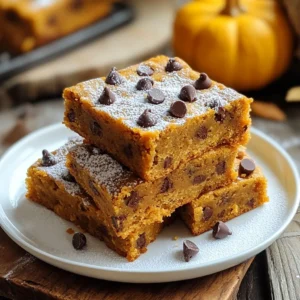 To make these tasty blondies, you need simple ingredients. Here’s what you will need: - 1 cup canned pumpkin puree - 1/2 cup brown sugar - 1/2 cup granulated sugar - 1/2 cup unsalted butter, melted - 2 large eggs - 1 teaspoon vanilla extract - 1 1/2 cups all-purpose flour - 1 teaspoon baking powder - 1/2 teaspoon baking soda - 1 teaspoon pumpkin pie spice - 1/4 teaspoon salt - 1 cup chocolate chips (semi-sweet or dark) These ingredients come together to create a sweet and rich treat. The pumpkin adds moisture and flavor, while the sugars help with sweetness and texture. You can make these blondies your own! Here are some optional ingredients and substitutions: - Use coconut sugar instead of brown sugar for a different taste. - Swap in almond flour for a gluten-free option. - Add nuts like walnuts or pecans for extra crunch. - Use white chocolate chips if you prefer a sweeter flavor. - Consider adding a pinch of cinnamon for a warm spice kick. These swaps can change the flavor without losing the essence of the blondies. You will need a few tools to bake these blondies: - 8x8 inch baking pan - Mixing bowls - Whisk or electric mixer - Rubber spatula - Measuring cups and spoons - Parchment paper (optional, for easy removal) - Wire rack for cooling Having the right tools makes baking easier and more fun. You can enjoy the process and create a delicious treat! {{ingredient_image_1}} Start by preheating your oven to 350°F (175°C). Grab an 8x8 inch baking pan. You can grease the pan with butter or oil. Alternatively, line it with parchment paper for easy removal. This helps the blondies come out perfectly. In a large mixing bowl, add 1 cup of canned pumpkin puree. Next, mix in 1/2 cup of brown sugar and 1/2 cup of granulated sugar. Stir these until they blend well. Then, pour in 1/2 cup of melted unsalted butter. Stir until everything is combined. Now add 2 large eggs and 1 teaspoon of vanilla extract. Whisk until the mixture is smooth and creamy. In another bowl, whisk together 1 1/2 cups of all-purpose flour, 1 teaspoon of baking powder, 1/2 teaspoon of baking soda, 1 teaspoon of pumpkin pie spice, and 1/4 teaspoon of salt. Make sure you mix these dry ingredients well. This step is key for the right texture. Now, gently fold the dry mixture into the wet ingredients. Be careful not to overmix. Next, fold in 1 cup of chocolate chips. Reserve a few for topping. Pour the batter into the prepared pan, smoothing it out. Sprinkle the reserved chocolate chips on top. Bake for 25-30 minutes. Check for doneness with a toothpick. If it comes out clean, your blondies are ready! Allow them to cool for about 15 minutes in the pan. Then, move them to a wire rack to cool completely before cutting into squares. To get soft and chewy blondies, mix just enough. Combine wet and dry ingredients until they are just blended. Overmixing can make your blondies tough. Keep an eye on baking time. You want a toothpick to come out clean, but not dry. One common mistake is using too much flour. Always spoon it into your measuring cup, then level it off. Another mistake is not cooling them long enough. If you cut them too soon, they may fall apart. Lastly, don’t skip greasing the pan or using parchment paper. This helps with easy removal. For extra flavor, try adding nuts or dried fruits. Chopped pecans or walnuts add crunch. You can also switch up the chocolate chips. Use dark chocolate for a richer taste or white chocolate for sweetness. For presentation, serve the blondies on a rustic wooden board. A dusting of powdered sugar can make them look fancy. Add a few mini chocolate chips on the plate for fun! Pro Tips Use Fresh Pumpkin Puree: While canned pumpkin puree works well, using fresh pumpkin can enhance the flavor and texture of your blondies. Roast and puree your own pumpkin for a more vibrant taste. Check Your Oven Temperature: Oven temperatures can vary, so it’s a good idea to use an oven thermometer to ensure your blondies bake perfectly. Adjust baking time accordingly for even results. Experiment with Mix-ins: Feel free to customize your blondies by adding nuts, dried fruits, or even white chocolate chips for a different flavor profile. Get creative! Store Properly: To keep your blondies fresh, store them in an airtight container at room temperature for up to 5 days or refrigerate them for a longer shelf life. You can also freeze them for up to 3 months. {{image_2}} You can make these blondies gluten-free easily. Swap the all-purpose flour for a gluten-free flour blend. Make sure it has a binding agent, like xanthan gum. This helps keep the texture light and chewy. Just measure the flour blend cup for cup. Follow the rest of the recipe as usual for delicious results. For a vegan twist, replace the eggs with flax eggs. Mix one tablespoon of flaxseed meal with three tablespoons of water. Let it sit for five minutes to thicken. Use a plant-based butter or coconut oil instead of unsalted butter. Make sure your chocolate chips are dairy-free. This way, you keep the flavor while making them vegan-friendly. You can add new flavors to your blondies for fun. Mix in nuts like walnuts or pecans for a crunchy texture. If you love spice, add a pinch of cayenne or ginger. This will give your blondies a warm kick. For a richer taste, try using dark chocolate chips instead of semi-sweet. Each change can create a new favorite twist! To keep your chocolate chip pumpkin blondies fresh, store them in an airtight container. This method helps the blondies stay moist and flavorful. You can keep them on the counter for up to three days. If you want to store them longer, the fridge is a great option. Just make sure to wrap them well to avoid drying out. Freezing blondies is easy and smart. Cut them into squares before freezing. Place the squares in a single layer on a baking sheet. Freeze them for about an hour, then transfer them to a freezer bag. They can last up to three months in the freezer. When you want to enjoy them, just pull out the number you need. To reheat your blondies, use the microwave for quick results. Heat them for about 10-15 seconds. You can also use the oven. Preheat it to 350°F (175°C). Place the blondies on a baking sheet and warm them for about 5-10 minutes. This method helps keep them soft and gooey. Enjoy them warm with a scoop of ice cream if you like! Yes, you can use fresh pumpkin. Just cook and puree it. Make sure it is smooth. This adds a fresh flavor. Fresh pumpkin may have more moisture, so you might need to adjust flour slightly. Check the edges for a light golden color. Insert a toothpick into the center. If it comes out clean, they are done. If it has wet batter, bake a few more minutes. You have many options! Try nuts, dried fruit, or butterscotch chips. Peanut butter chips add a fun flavor. You can also use white chocolate for a sweeter taste. Absolutely! These blondies are perfect for gifts. They look great and taste delicious. Pack them in a nice box or tin. Add a ribbon for a special touch. Your friends and family will love them! You learned how to make chocolate chip pumpkin blondies. We covered key ingredients, mixing steps, and baking tips. I provided fun variations and storage info to keep them fresh. Remember, slight tweaks can elevate your blondies' taste. Don’t shy away from experimenting! With practice, you’ll master this recipe. Enjoy baking and sharing your delicious blondies with friends and family. Happy baking!