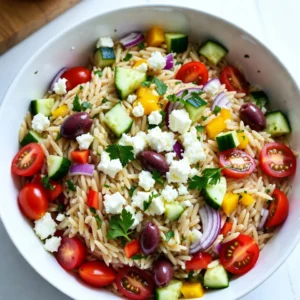 To make a tasty Greek Orzo Salad with Feta, you'll need the following: - 1 &frac12; cups orzo pasta - 1 cup cherry tomatoes, halved - 1 medium cucumber, diced - 1 bell pepper (red or yellow), diced - &frac12; red onion, finely chopped - 1 cup Kalamata olives, pitted and halved - 1 cup feta cheese, crumbled - &frac12; cup fresh parsley, chopped - &frac14; cup extra virgin olive oil - 2 tablespoons red wine vinegar (or lemon juice) - 1 teaspoon dried oregano - Salt and black pepper to taste I know you might not have every ingredient on hand. Here are some easy swaps: - Orzo: Use quinoa or farro if you want a gluten-free option. - Kalamata olives: Black olives work well too. - Feta cheese: Try goat cheese or mozzarella for a different taste. - Red wine vinegar: Lemon juice gives a bright flavor that works great. - Fresh parsley: Basil or mint can add a fresh twist. This salad is not just tasty; it's healthy too! Here&rsquo;s what you get per serving: - Calories: 320 - Protein: 10g - Carbohydrates: 30g - Fat: 20g - Fiber: 3g - Sugar: 2g This Greek Orzo Salad with Feta is full of flavor and good for you. Enjoy making it! {{ingredient_image_1}} Start by boiling a large pot of water. Add a pinch of salt to the water. Once it boils, add 1 &frac12; cups of orzo pasta. Cook the orzo according to the package instructions until it is al dente. This usually takes about 8 to 10 minutes. When it's done, drain the pasta in a colander. Rinse it under cold water to stop the cooking process. While the orzo cooks, grab your chopping board. Dice 1 medium cucumber and chop 1 cup of cherry tomatoes in half. Next, take 1 bell pepper and dice it. You can use red or yellow bell pepper based on your taste. Finally, finely chop &frac12; of a red onion. Set all the chopped veggies aside for later. In a small bowl, combine &frac14; cup of extra virgin olive oil and 2 tablespoons of red wine vinegar. If you prefer, you can use lemon juice instead. Add 1 teaspoon of dried oregano, salt, and black pepper to taste. Whisk all the ingredients together until they blend well. This dressing adds great flavor to your salad. In a large mixing bowl, combine the cooked orzo, chopped vegetables, and 1 cup of Kalamata olives. Sprinkle in 1 cup of crumbled feta cheese and &frac12; cup of chopped parsley. Gently toss everything together so the ingredients mix well. The colors and textures will look amazing already! Now, it&rsquo;s time to taste your salad. Grab a spoon and take a small bite. Adjust the seasoning if needed. You might add more salt, pepper, or olive oil to enhance the flavor. This step is important for making the salad delicious. Cover the salad with plastic wrap or a lid. Place it in the fridge for at least 30 minutes. This chilling time helps the flavors mix nicely. When you&rsquo;re ready to serve, take it out and give it a gentle toss. You can serve it chilled or at room temperature. For a nice touch, garnish with extra feta and parsley before serving. To stop orzo from sticking, add salt to the water. Salty water helps keep the pasta separate. Stir the orzo during cooking to break up clumps. After cooking, rinse the orzo under cold water. This cools it quickly and stops the cooking process. Make sure it's dry before adding it to the salad. A little olive oil can also help keep it from sticking together. Chop your vegetables evenly for a nice look. Start with the cherry tomatoes. Cut them in half to let their juice mix in. Next, take the cucumber and dice it into small pieces. This adds crunch to the salad. For the bell pepper, remove the seeds before dicing. A sharp knife makes cutting easier and safer. Finally, the red onion should be finely chopped to balance its strong taste. Fresh herbs bring life to your salad. Use parsley for a bright taste. Dried oregano adds warmth and earthiness. When mixing, taste as you go. This helps you find the right flavor. If you want a kick, add a pinch of red pepper flakes. A splash of lemon juice can brighten the flavors, too. Mixing these herbs and spices will make your Greek orzo salad really shine. Pro Tips Cook Orzo Al Dente: Make sure to cook the orzo just until al dente for the best texture. Overcooking can make it mushy. Use Fresh Herbs: Fresh parsley adds a vibrant flavor. You can also experiment with fresh mint for a refreshing twist. Chill for Flavor: Allowing the salad to chill for at least 30 minutes helps the flavors meld together, enhancing the overall taste. Customize Your Veggies: Feel free to add or substitute other vegetables like bell peppers or artichokes based on your preference. {{image_2}} You can make this Greek Orzo Salad heartier by adding protein. Cooked chicken is a great choice. Simply grill or bake it, then slice it into pieces. Shrimp is another tasty option. Saut&eacute; shrimp in olive oil and garlic until they are pink. For a plant-based option, try chickpeas. Drain and rinse canned chickpeas, then mix them in. Each protein option adds flavor and keeps you full. This salad is flexible with vegetables. You can use what is fresh and in season. In summer, add sweet corn or zucchini. In fall, include roasted butternut squash or Brussels sprouts. You can also use leafy greens like spinach or arugula. These swaps let you enjoy different flavors throughout the year. Plus, it keeps the salad exciting and fresh! Feta is classic, but you can try other cheeses. Goat cheese brings a creamy texture and tangy flavor. Crumble it over the salad for a nice twist. Ricotta is another option. It adds richness and softness. You can dollop it on top for a lovely presentation. Switching up the cheese can change the whole dish while keeping it delicious. To keep your Greek orzo salad fresh, store it in an airtight container. This helps prevent air from drying it out. If you have added dressing, keep it separate to maintain crunch in the veggies. Use a small jar for the dressing, then mix it in just before serving. When stored properly, your orzo salad can last up to three days in the fridge. After this time, the veggies may lose their crispness and flavor. Always check for any signs of spoilage before eating. If it smells off or looks unusual, it&rsquo;s best to toss it out. Freezing is not ideal for this salad. The orzo and vegetables can become mushy once thawed. However, if you want to freeze it, do so without the dressing. Store the salad in a freezer-safe container and consume it within a month for best quality. When ready to eat, let it thaw in the fridge overnight, then add fresh dressing before serving. If you can't find orzo, don't worry! You can use other small pastas like ditalini or couscous. Quinoa and rice also work well, adding a different texture. Just make sure to cook them according to the package instructions. Each option brings its own flavor and style. Yes, you can make this salad ahead of time! It tastes even better after sitting for a few hours. I suggest making it the night before. Just store it in the fridge. It allows all the flavors to blend nicely. If you plan to serve it later, add the dressing just before serving. Greek orzo salad goes great with many dishes. Try serving it alongside grilled chicken or fish. It also pairs well with lamb or veggie skewers. For a lighter meal, serve it with a soup like tomato or lentil. The options are endless, making it a versatile side dish! You learned how to make a delicious Greek Orzo Salad by combining fresh ingredients and flavors. You explored tips for cooking, seasoning, and storage. Remember, you can swap ingredients to fit your taste. This salad is perfect for any meal or gathering. Enjoy making it your own with different proteins or veggies! Keep these ideas in mind, and your salad will always impress. Now, it&rsquo;s time to gather your ingredients and create something tasty!